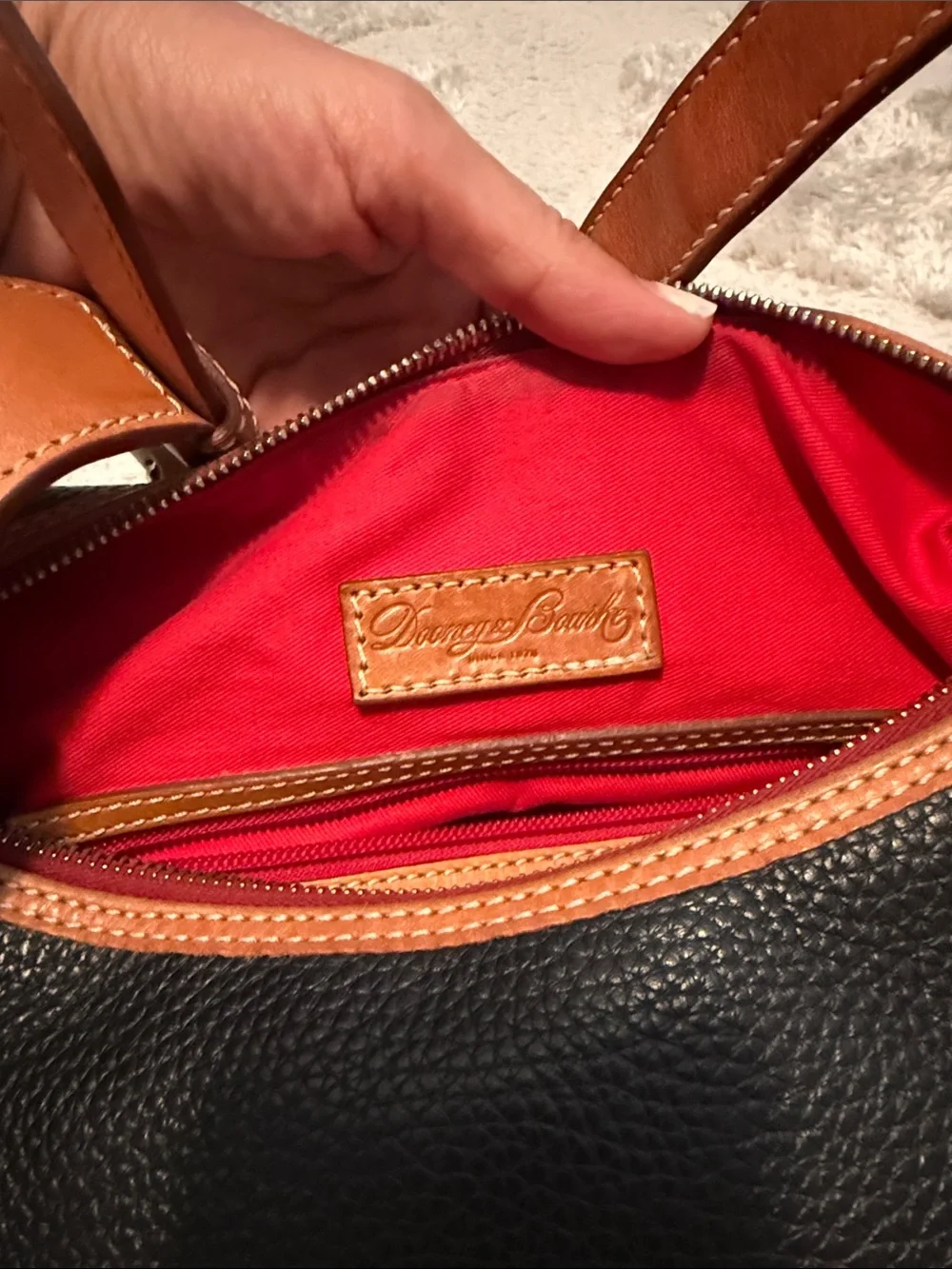 Dooney & Bourke Black and Tan Pebbled Leather Hobo with Tassel